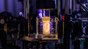 Holographic projection of a human ear model on a sample vial. 2026 Adrien Buttier/EPFL CC BY SA