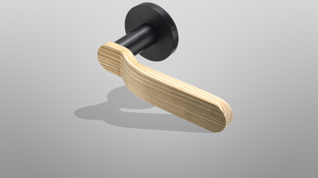 A new world opens for pinewood, here is a door handle made out of the compressed wood. ©EPFL+ECAL A new world opens for pinewood, here is a door handle made out of the compressed wood. ©EPFL+ECAL